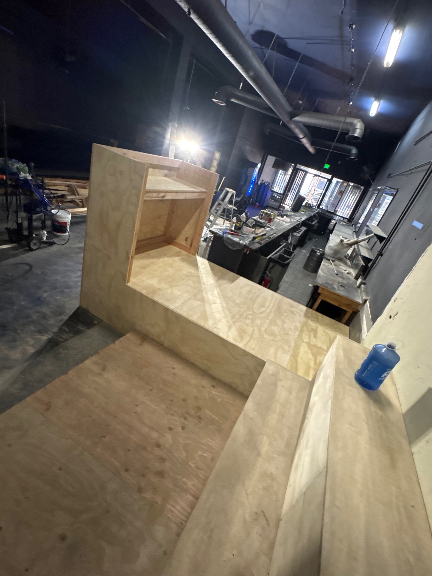 Custom DJ booth built in plywood on the raised platform