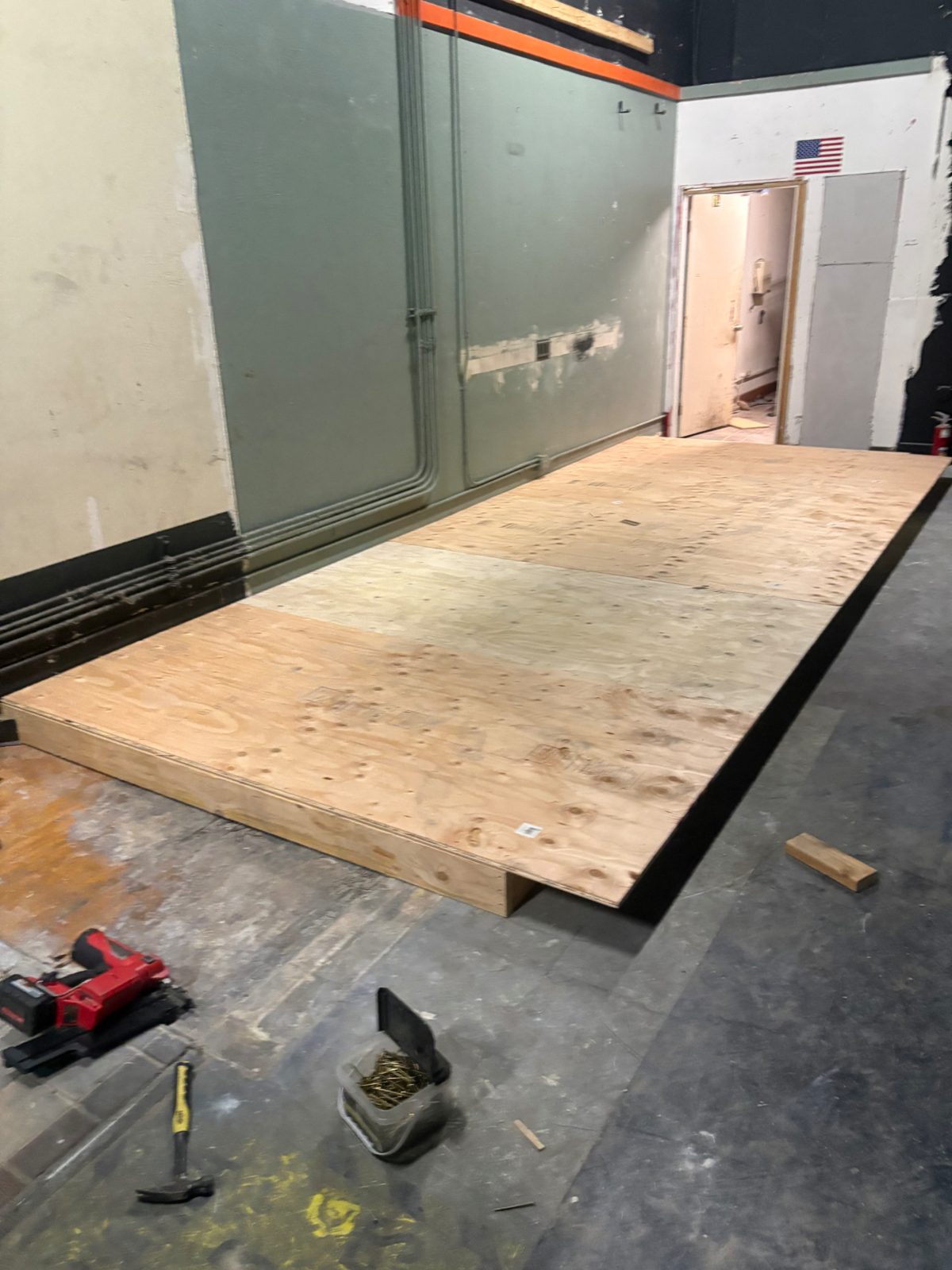 Plywood decking installed over the platform framing