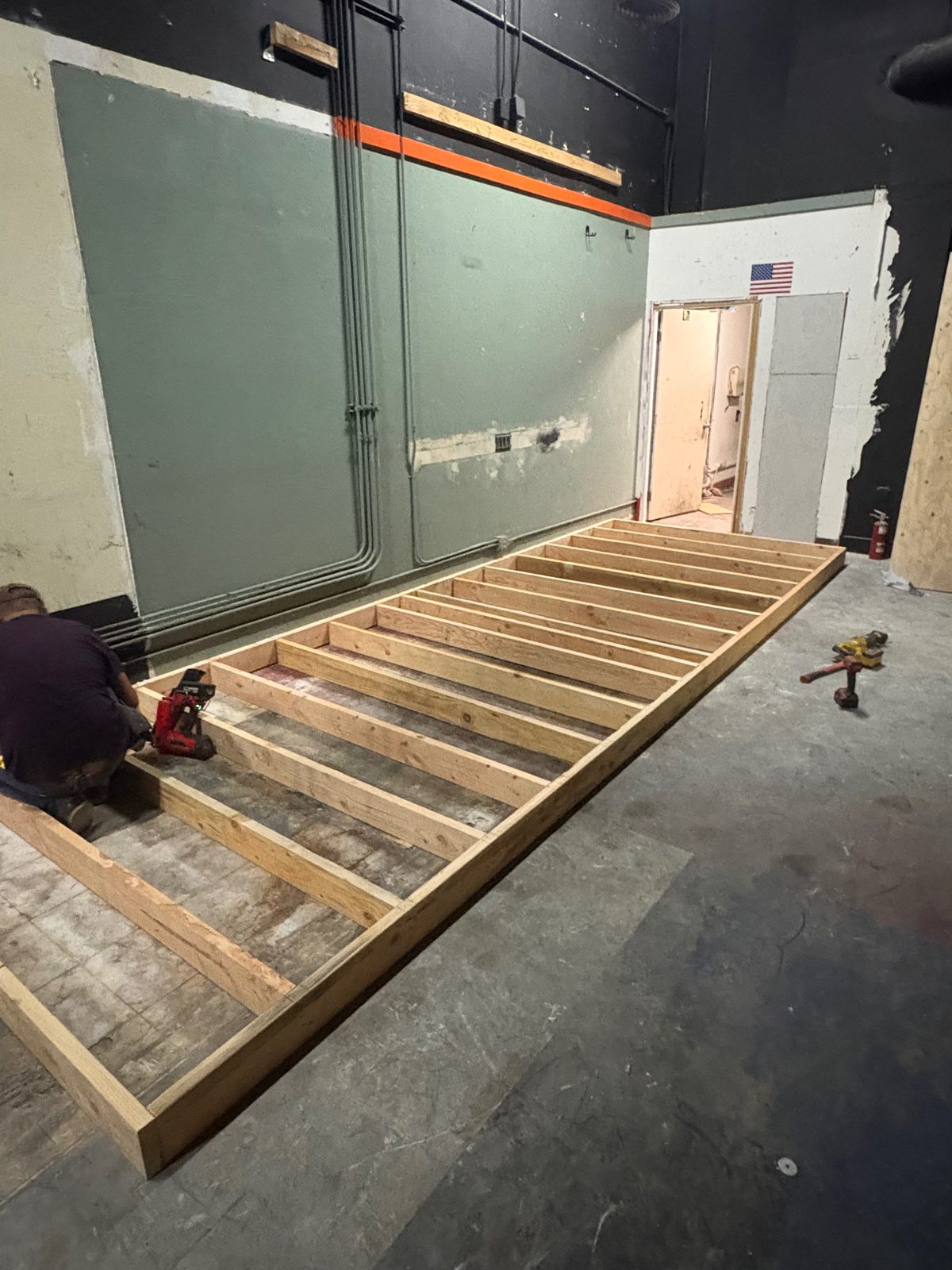 Platform framing being built in the commercial interior