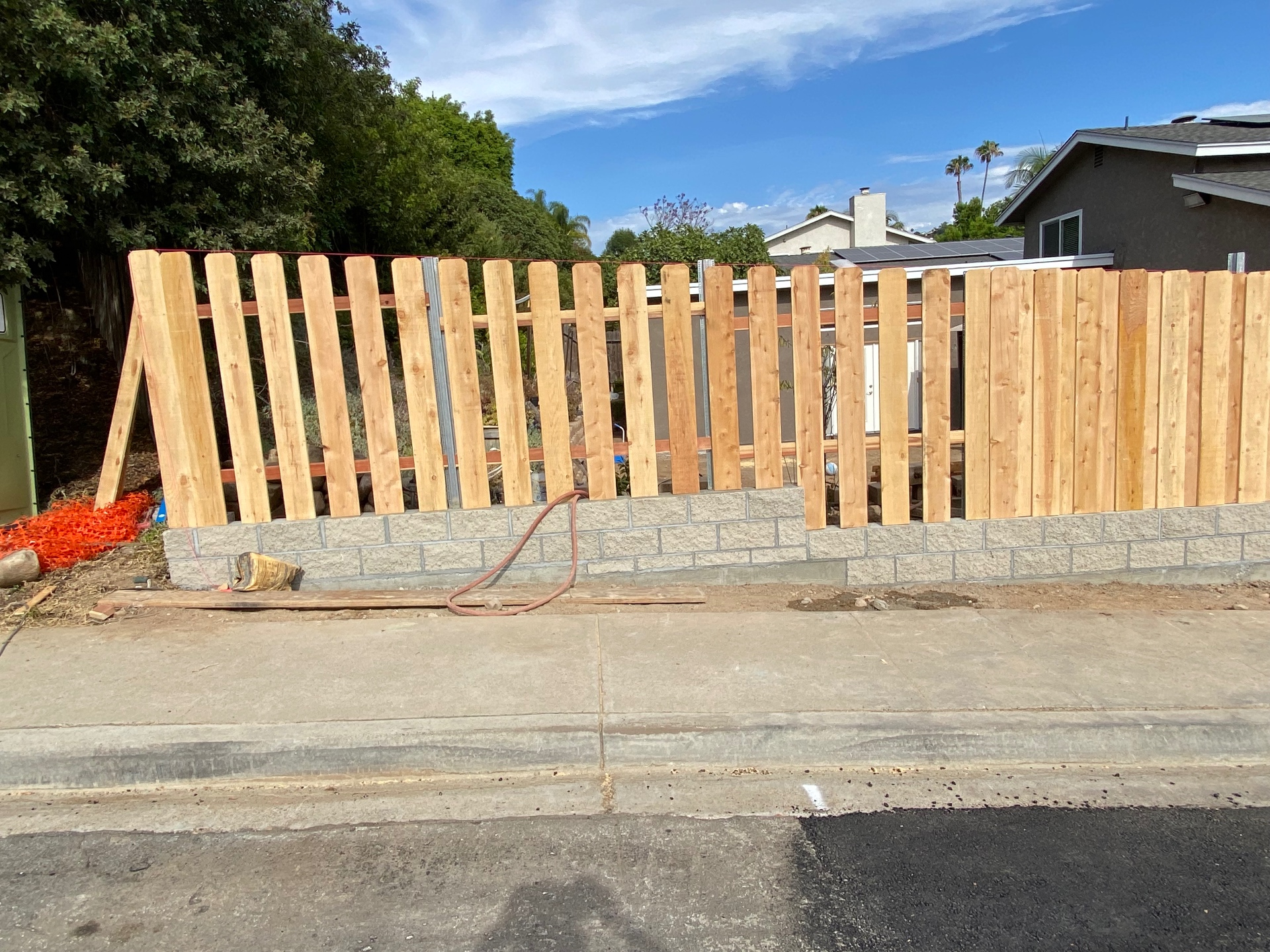 Block base under construction with fence posts set