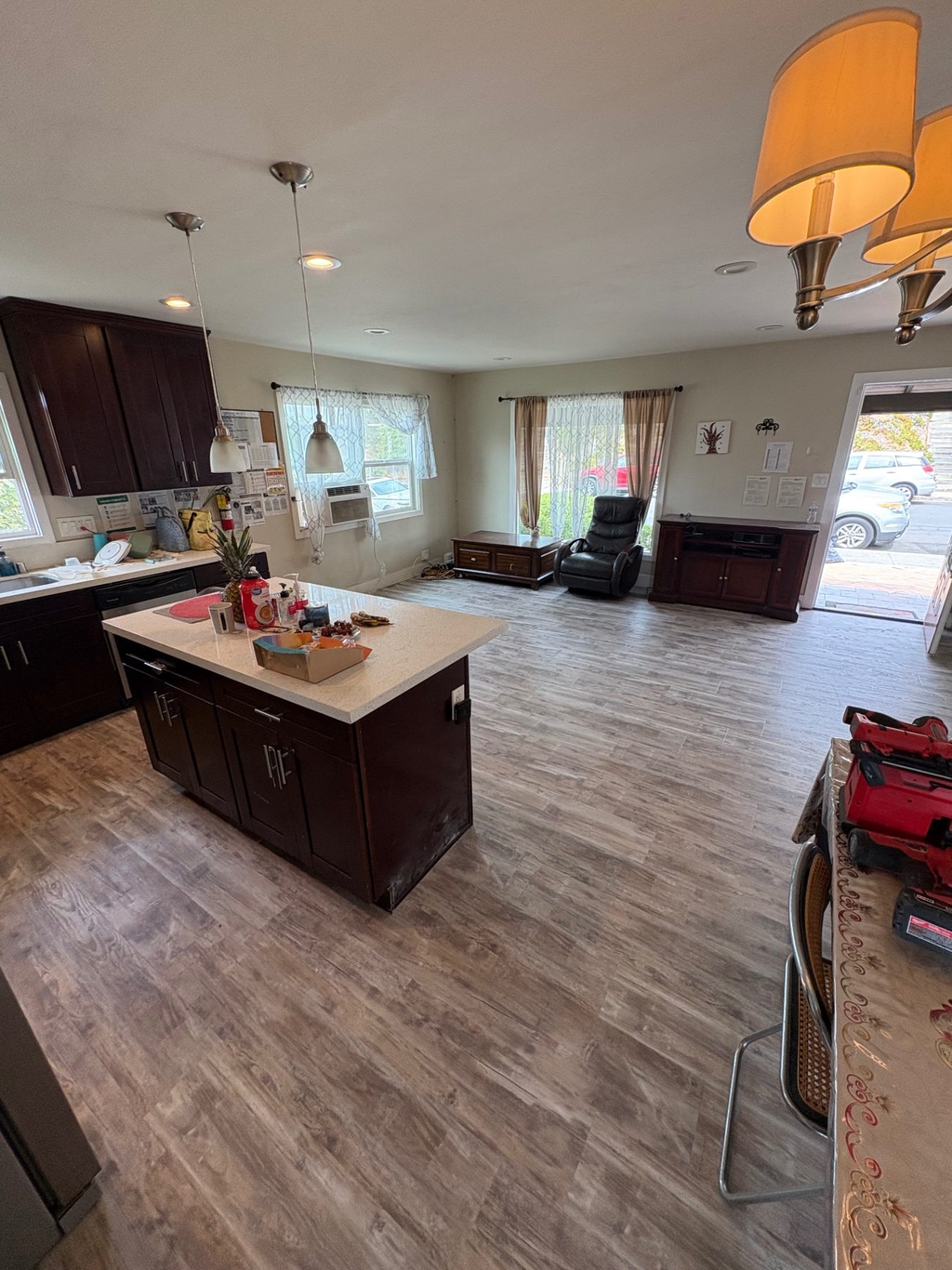 Completed luxury vinyl plank flooring in kitchen and living area