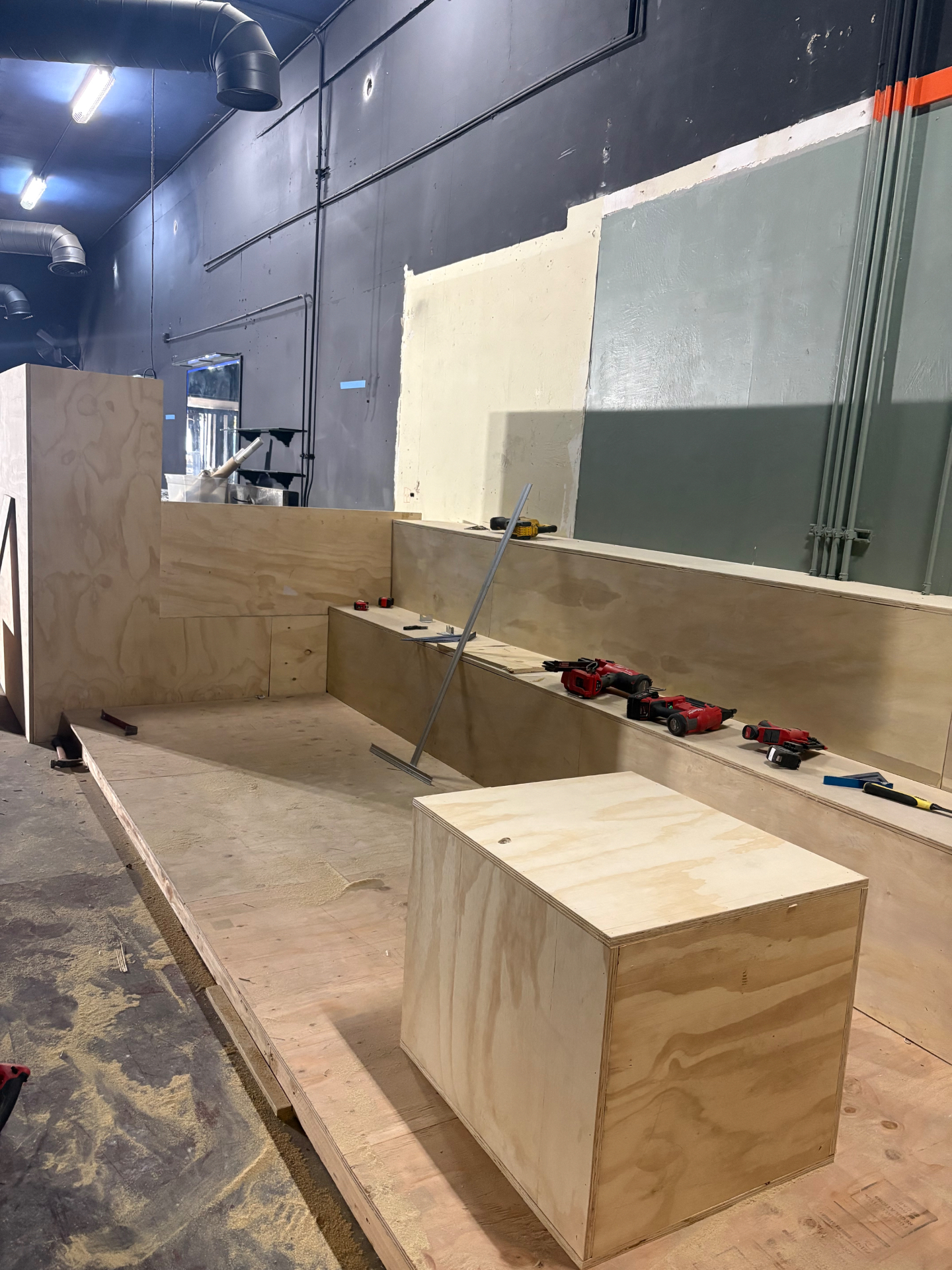 Custom freestanding plywood table on the finished platform decking