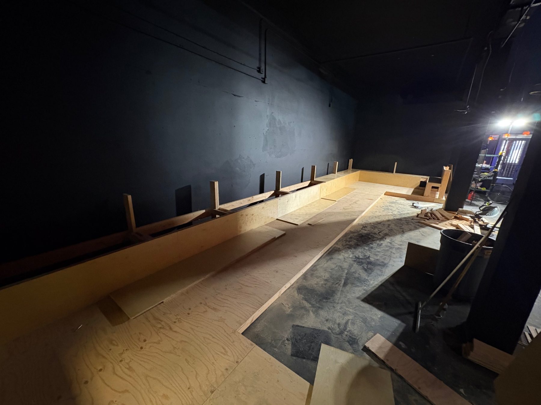 Plywood decking installation over custom platform framing
